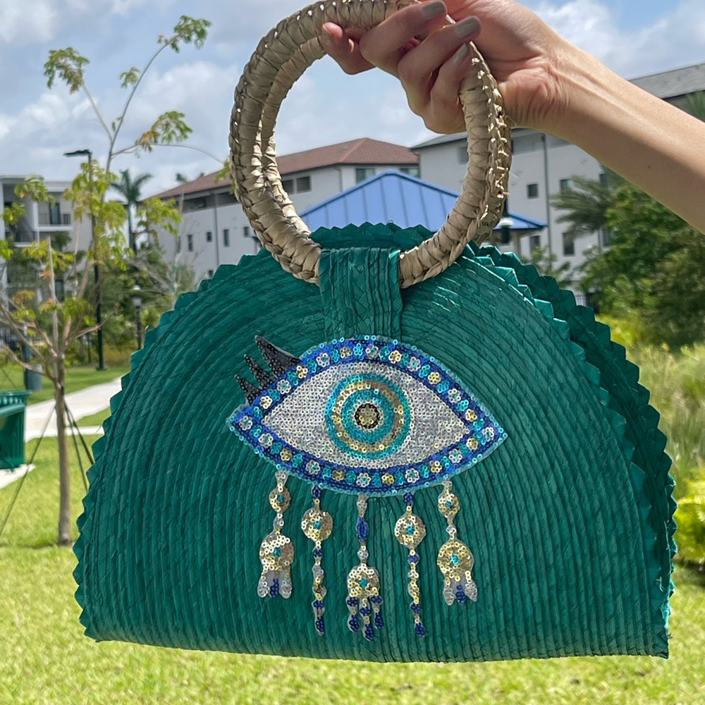 Bolso azul estilo taco. Con ojo turco